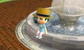 A Mii relaxing at the fountain.